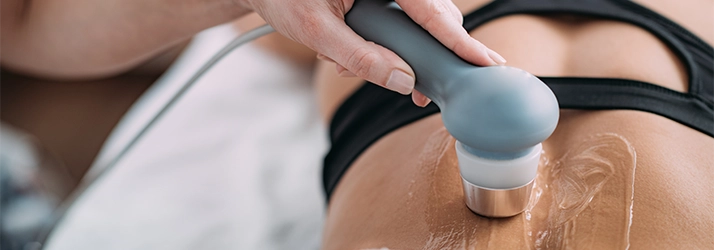 Chiropractic Quincy MA Ultrasound An individual undergoing therapeutic ultrasound care on their lower back.